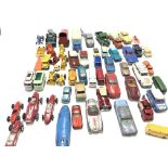 Collection of playworn loose model vehicles by various manufacturers including Dinky. Corgi and