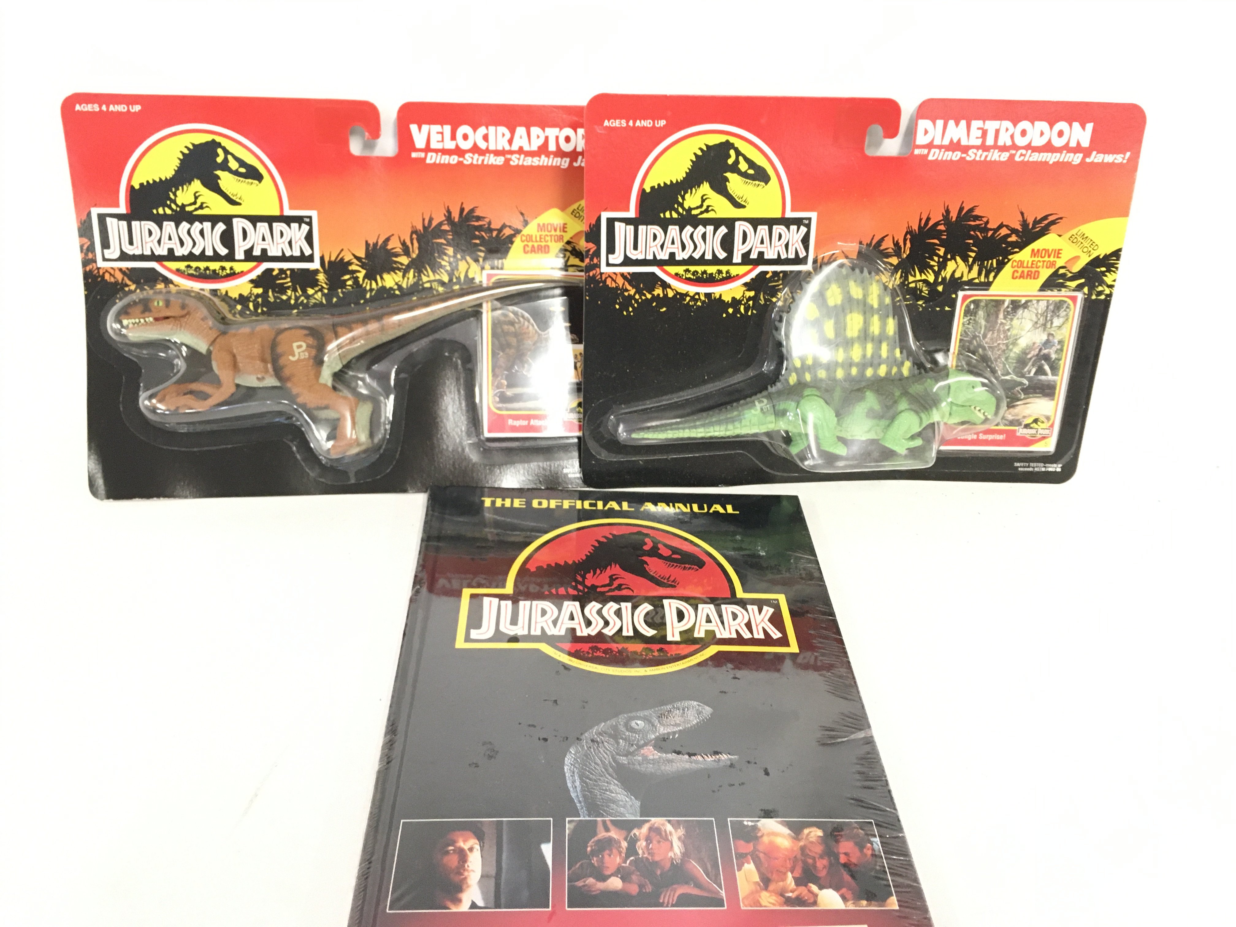 2 Carded Jurassic Park Figures and a sealed Annual