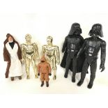 A Collection of Vintage 12 inch Star Wars Figures.