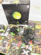 A Boxed Microsoft X Box Video Game System including games and accessories.
