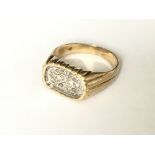 A pave set oval diamond fluted signet ring