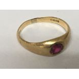 An 18carat gold ring set with a cut ruby ring size