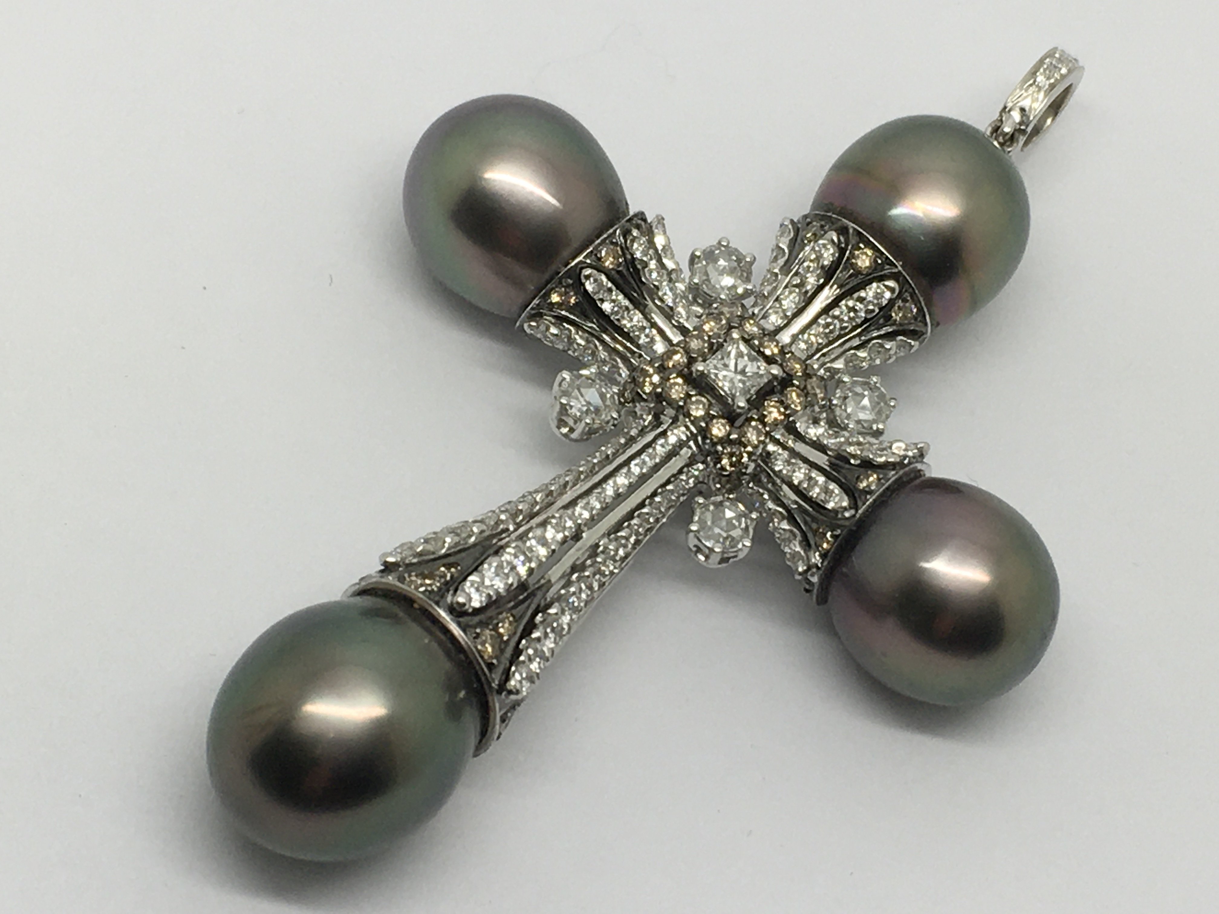 A quality diamond and Tahitian pearl cross pendent