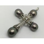 A quality diamond and Tahitian pearl cross pendent