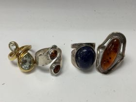 4 good silver and stone set rings.