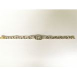 A 9ct gold stone set Greek pattern bracelet