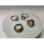 4 Gold stone set rings.