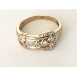 A diamond set buckle ring in 9ct gold