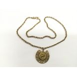 A 1/10 oz Krugerrand set in a 9ct gold pendant on