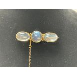 A 1920s gold mounted moonstone brooch. 4.5cm.