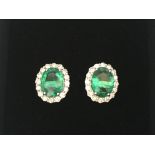 Pair of 18ct white gold oval emerald and RBC diamo