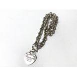 Withdrawn - A silver necklace with hear tag, the tag marked "P