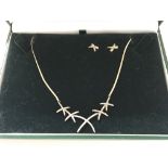 A 9ct gold necklace and earring set.