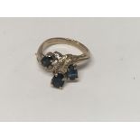 A 14 k gold ring inset with gem stones size L total weight 3.6 grams.