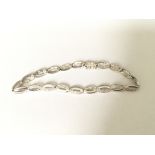 A white gold diamond set infinity link bracelet