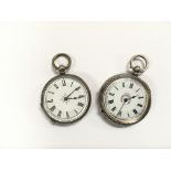 Two silver key wind pocket watches.