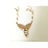 Wings of gold with natural pearls in 14ct gold
