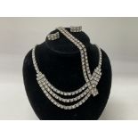 A 1930s graduated 3 row French paste and .935 silver suite of jewellery to include Necklace,