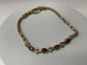 A pretty 14K yellow gold ruby and diamond bracelet