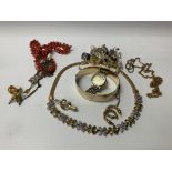 A small collection of mixed costume jewellery.