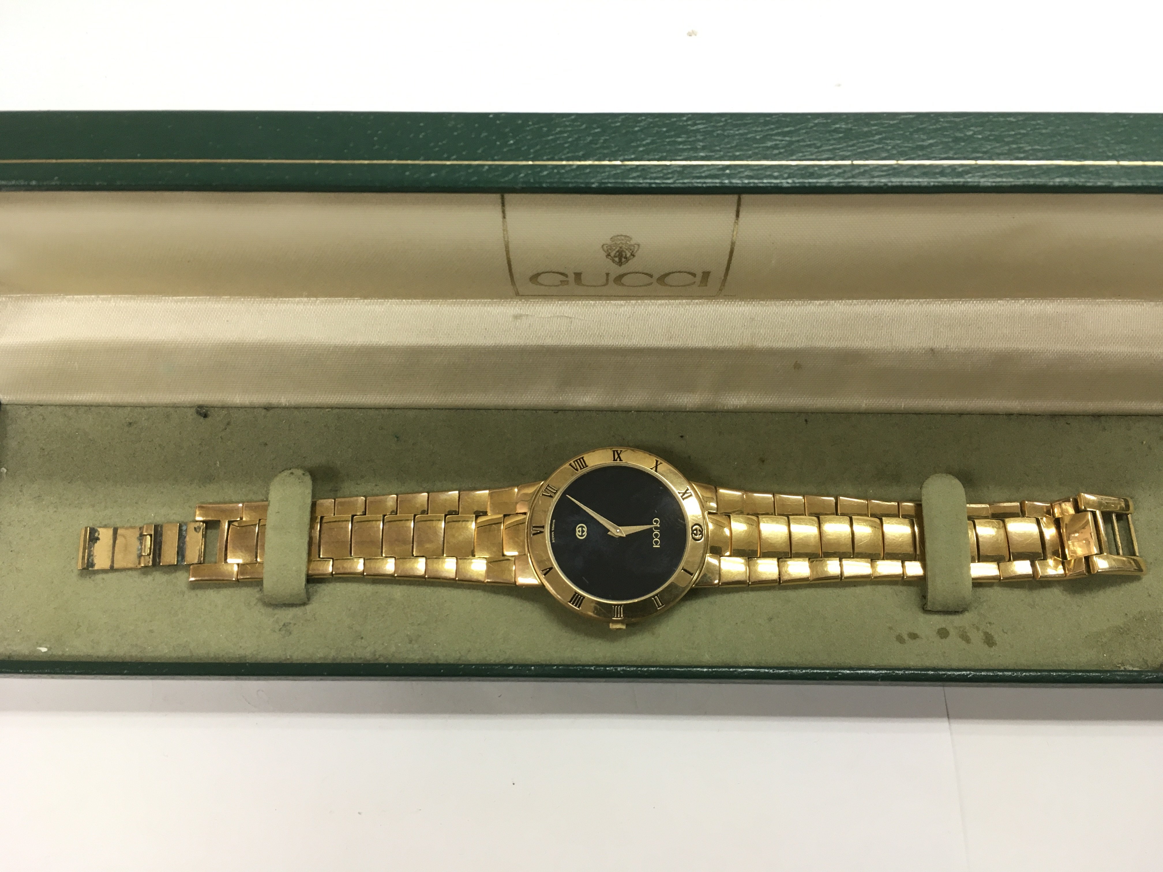 A boxed gold tone Gucci watch.