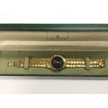 A boxed gold tone Gucci watch.