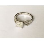 An unusual pave set diamond ring in white gold