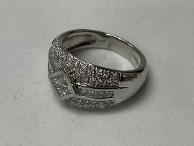 A heavy platinum dress ring inset with Princess an
