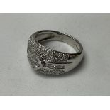 A heavy platinum dress ring inset with Princess an