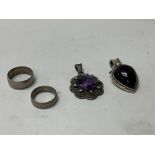 2 silver coin rings and 2 silver pendants