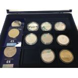 A collection of silver uncirculated Olympic coins