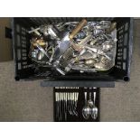 A box of various flatware.