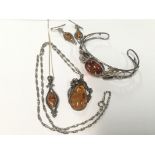 A collection of silver and amber jewellery
