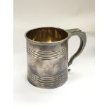 A George III silver tankard with a gilded interior
