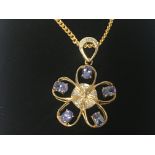 A 9ct gold diamond and tanzanite pendant on chain