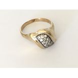 An unusual shape pave set ring in 9ct gold