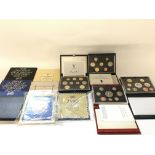 A collection of UK coin sets including uncirculate