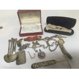 A collection of silver oddments including spoons a