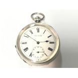 A silver pocket watch by Kendal & Dent