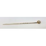 A 10ct gold diamond tie pin