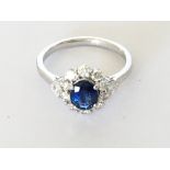 18ct white gold oval sapphire and RBC diamond clus