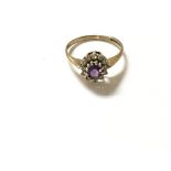 A 9ct amethyst and diamond ring. Size H 1/2 and 1.