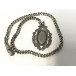 A silver Albert chain and fob