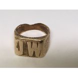 An unmarked gold ring with initials JW presumed 9c