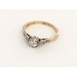 An 18ct gold and platinum diamond ring with diamon