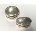 Two silver pill boxes