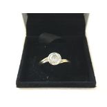 An 18ct gold diamond ring. Approximately 0.75 ct 5