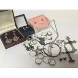 A collection of silver jewellery and gold earrings