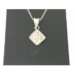 Princess diamonds pave set in a white gold pendant