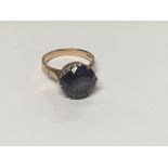 A 14 k gold ring inset with gem stone size L total weight 4 grams.